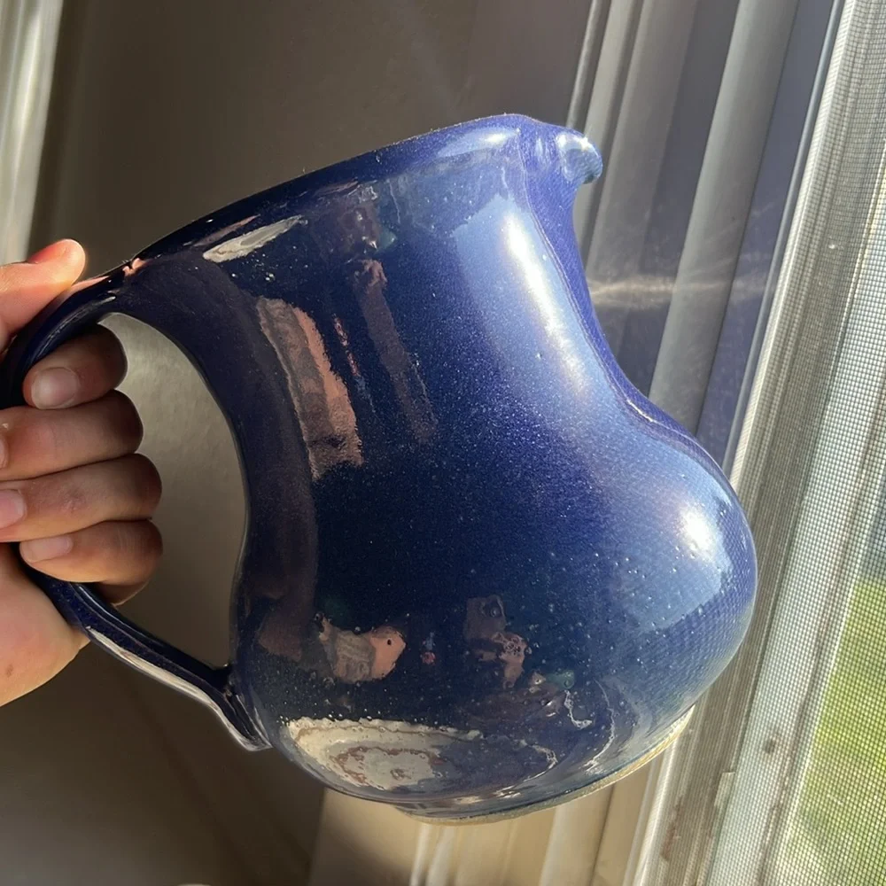 Handmade pottery pitcher blue glaze with handle